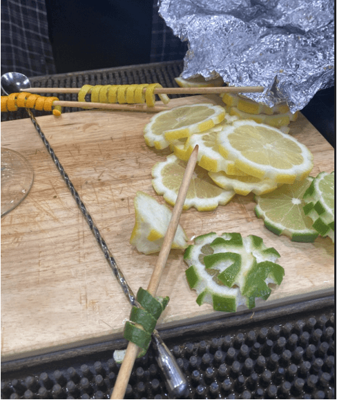Lemons and limes being prepared by a casino bartender for garnishes
