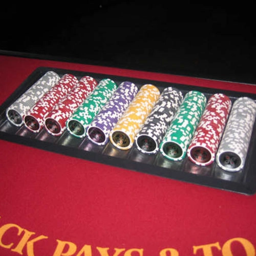 Professional casino chips on a Pai Gow table at a corporate event.