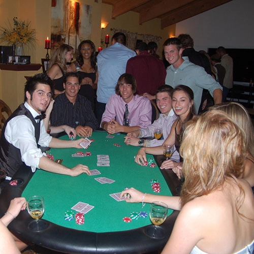 Poker tournament with guests at a poker table.