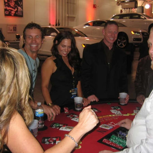 Casino event guests at a casino themed car show.