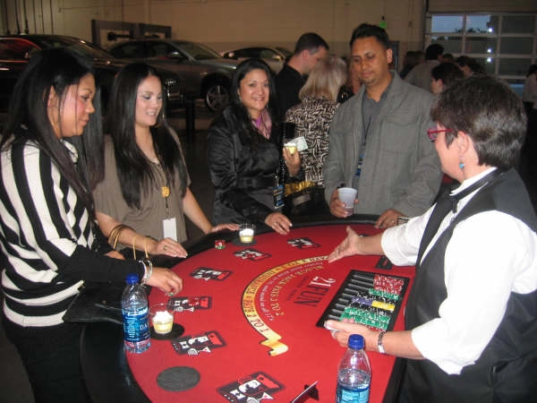 Fund-raiser charity event with guests playing at a blackjack table